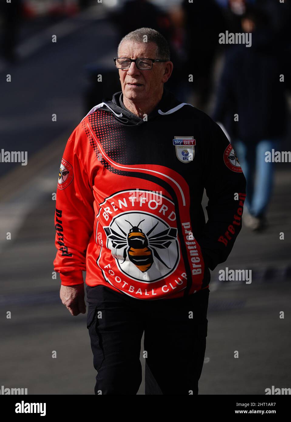 A Brentford fan outside the stadium before the Premier League match at the Brentford Community Stadium, London. Picture date: Saturday February 26, 2022. Stock Photo