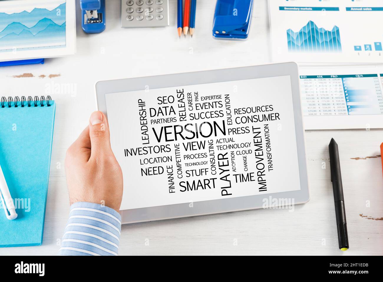 Businessman with a computer tablet at a work desk Stock Photo - Alamy