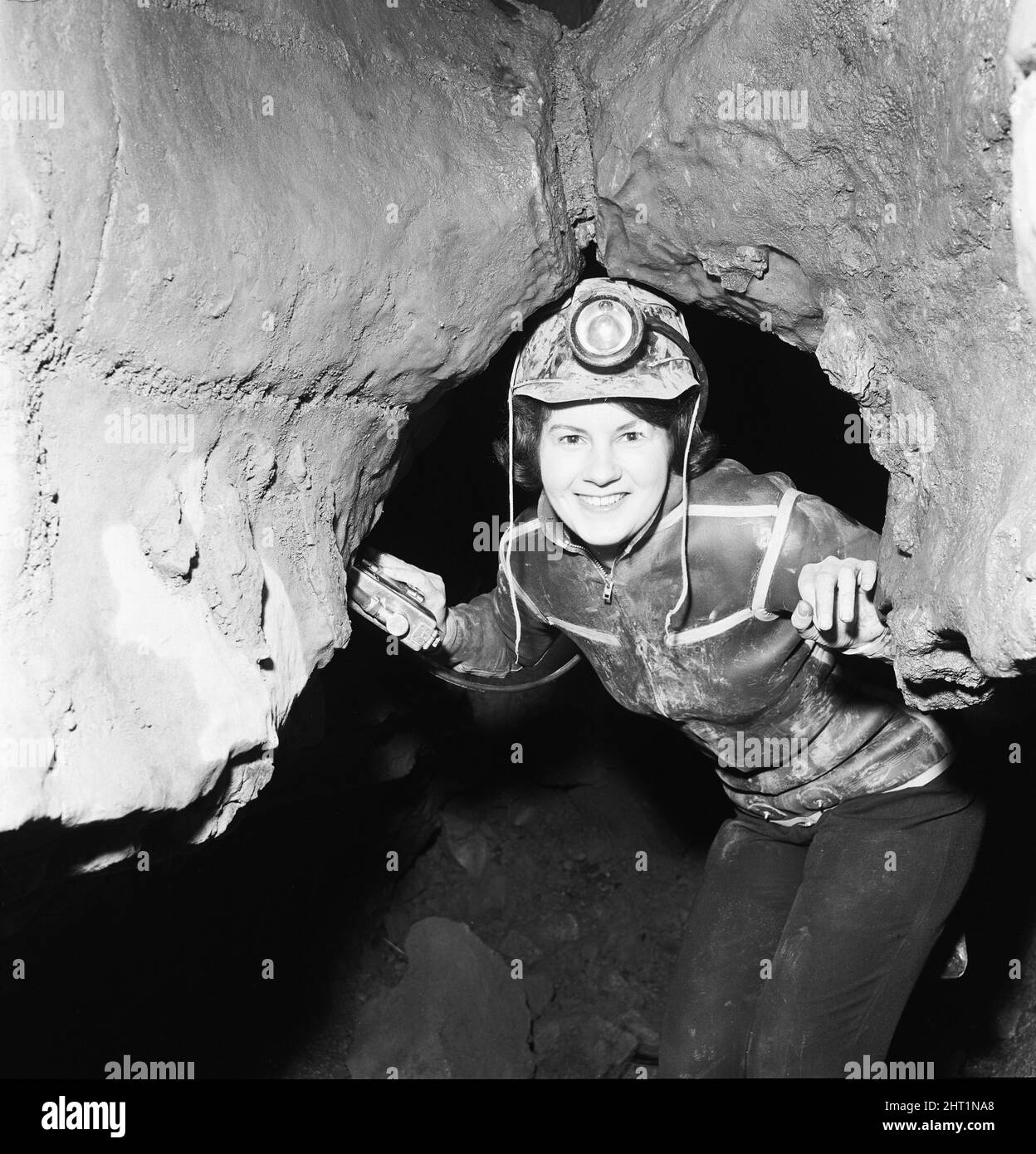 Eillen Davies seen here making her way thorough a series of caves under the Brecon Beacons neat Abercrave. 13th April 1966 Stock Photo