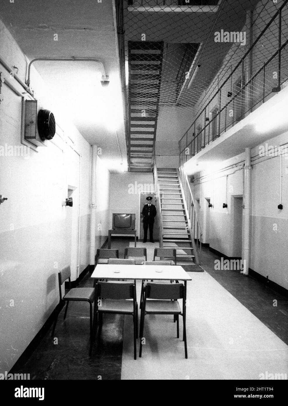 A prison guard on patrol by the recreation room in Durham Jail January 1966 Stock Photo