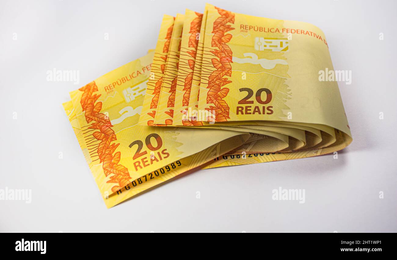 Closeup shot of 20 Brazilian real bills against a white background ...