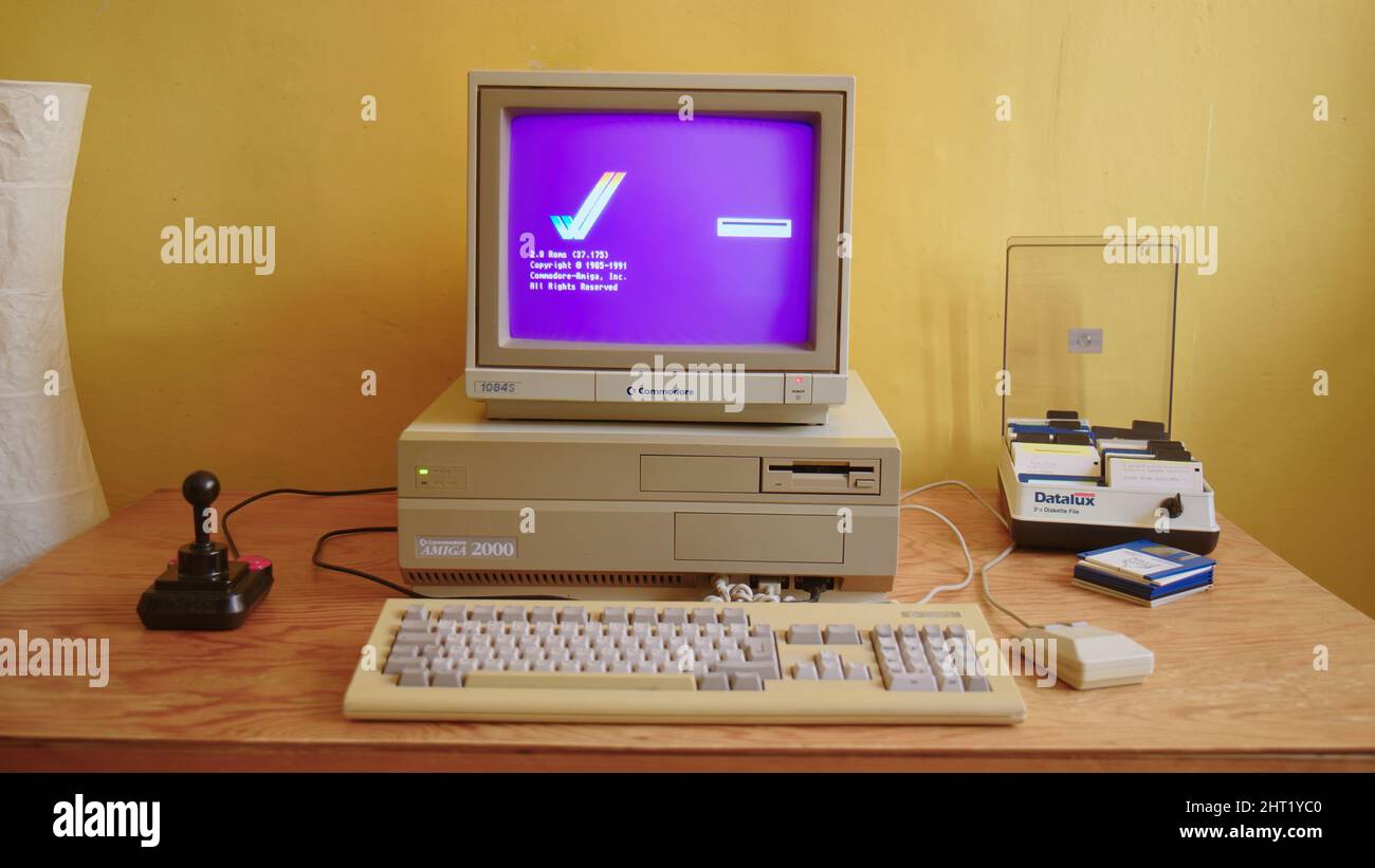 Vintage Commodore Amiga Boot Screen on classic Monitor 1084S and Amiga 2000 PC, Joystick Competition Pro Stock Photo