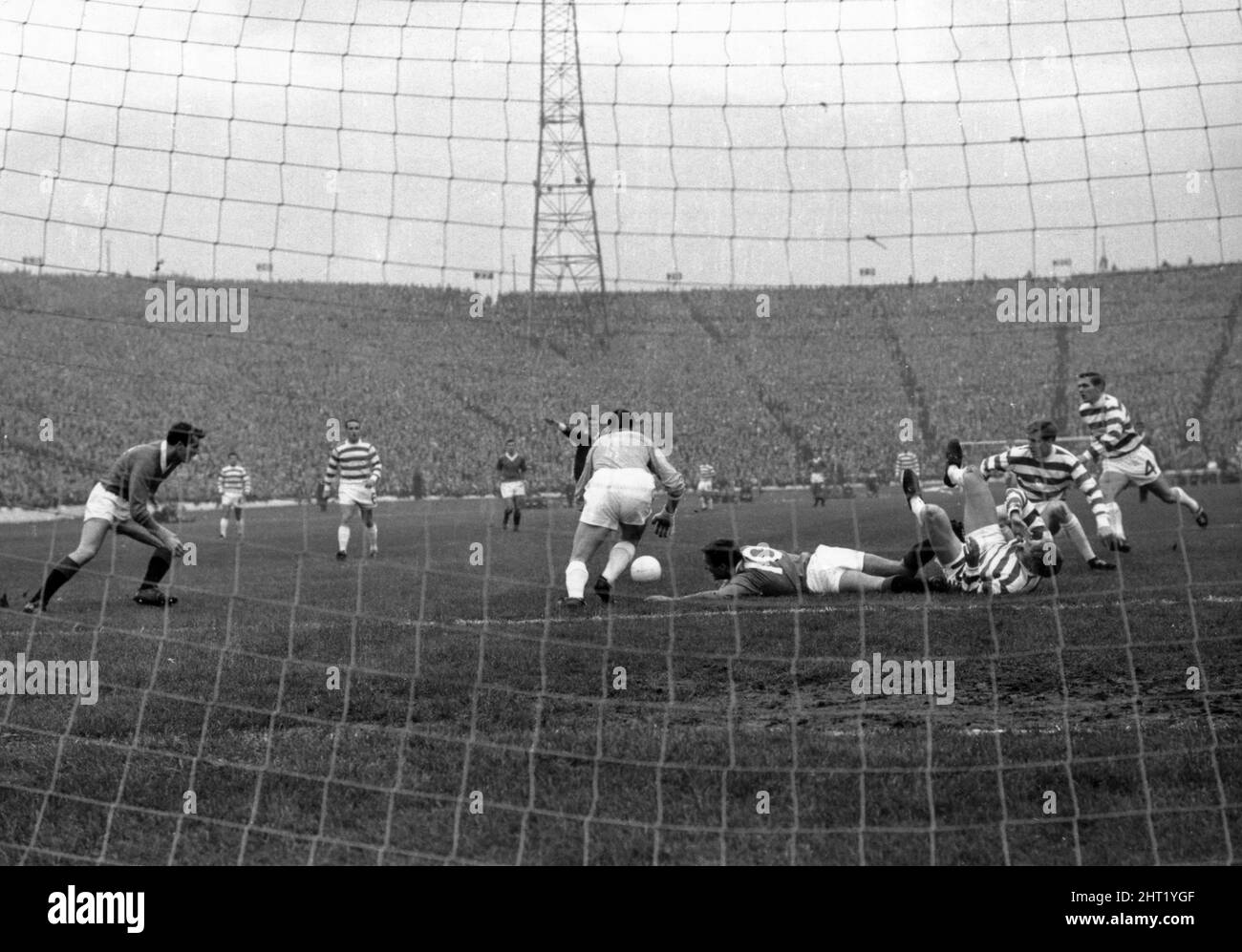 Celtic 1-0 Rangers, Scottish League Cup Final, Hampden Park, Glasgow, Scotland, Saturday 29th October 1966. No penalty, referee Tom ¿y¿harton waves play on as Rangers Alex Smith lies sprawled in the Celtic goalmouth with the Celtic defence in a tangle. Stock Photo