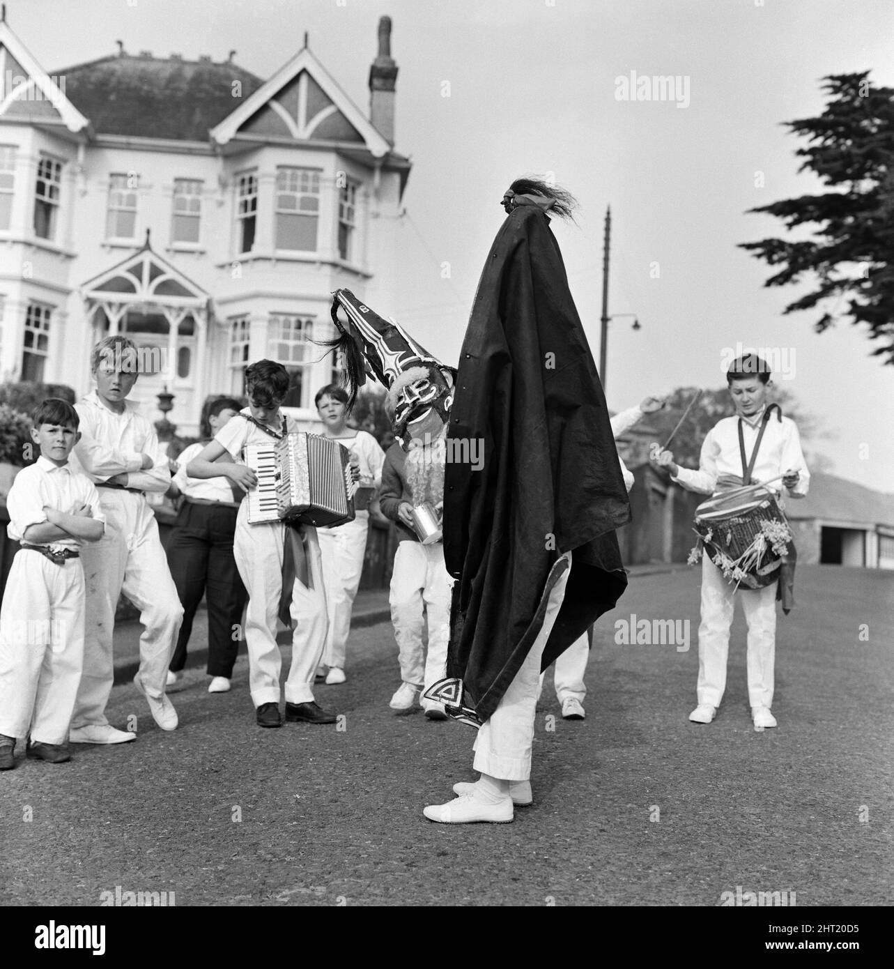 Visitors and townsfolk and Cornish exiles who return every year take part in the 36 hour festivities at the Padstow 'Obby ¿s celebrations to herald in the month of May with ancient rights of spring. 2nd May 1966. Stock Photo