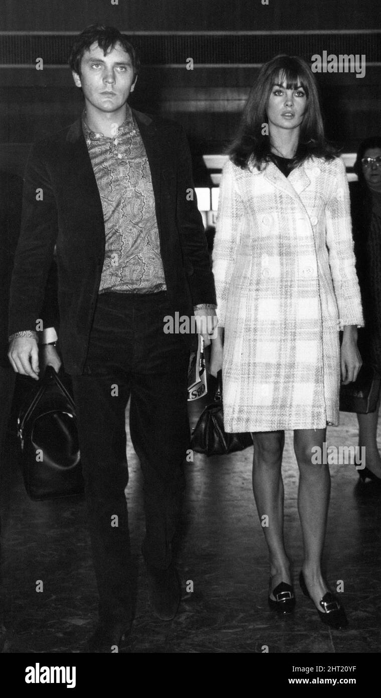 Terence Stamp and Jean Shrimpton, pictured together at London Heathrow Airport, 26th October 1965. The actor is accompanying his model girlfriend as she fulfils commitments in America and Australia. Stock Photo