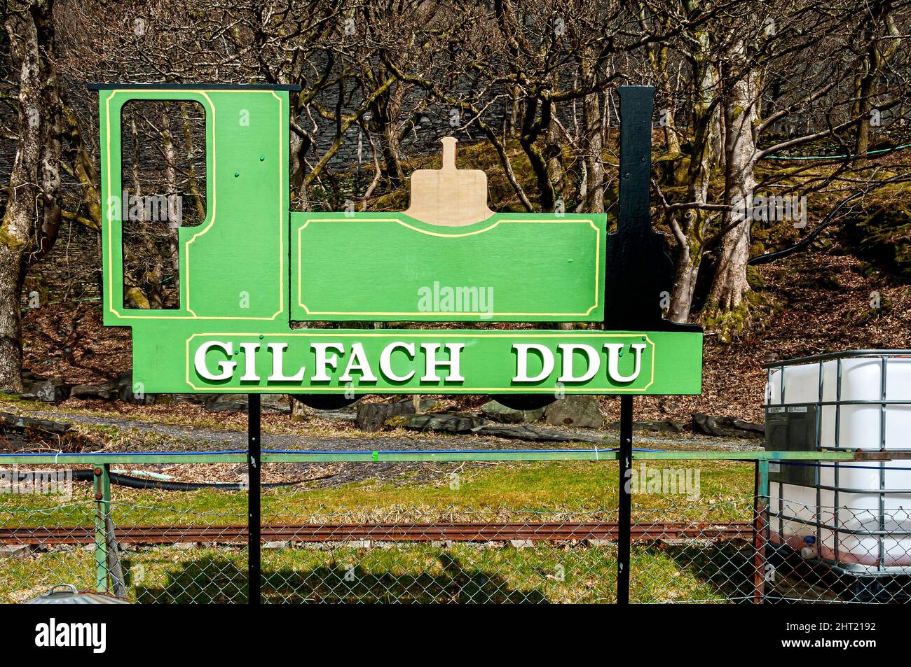 Steel cut into the shape of a narrow gauge locomotive and painted with its colours declares the station Gilfach DDU, on the Llanberis Lake Railway Stock Photo