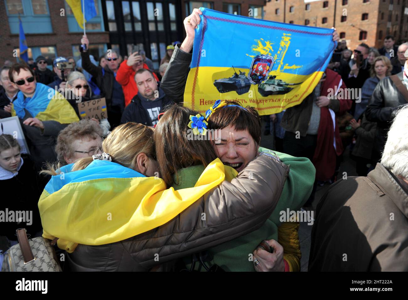 Svitlana Rood originally from the Donetsk region of Ukraine is hugged as she breaks down following her speech to the crowd.   Around the world the sho Stock Photo