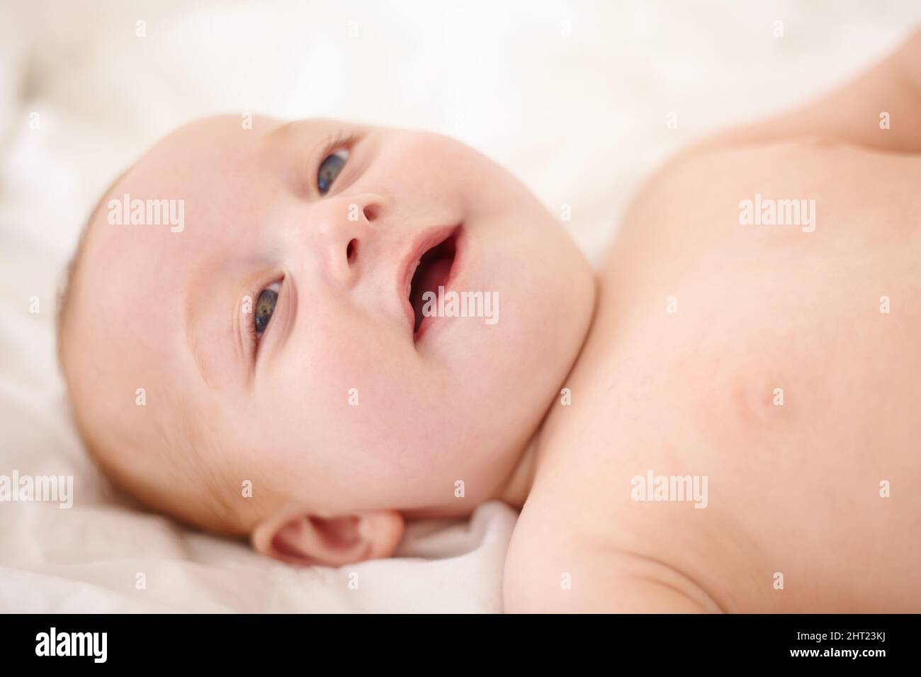 Pure sweetness. Sweet little baby smiling happily. Stock Photo