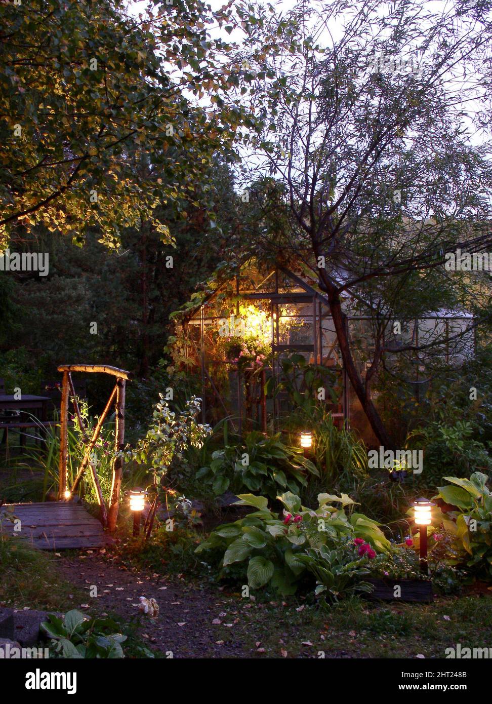 Garden lighting around pond Stock Photo