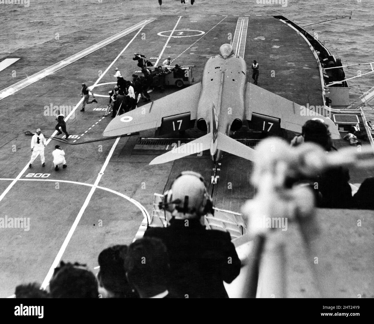 A supermarine Scimitar is manoeuvred on to the starboard catapult ready for take off on the deck of HMS Centaur, during a farewell exercise by the Fleet squadron. Liverpool, Merseyside, 19th August 1965. Stock Photo