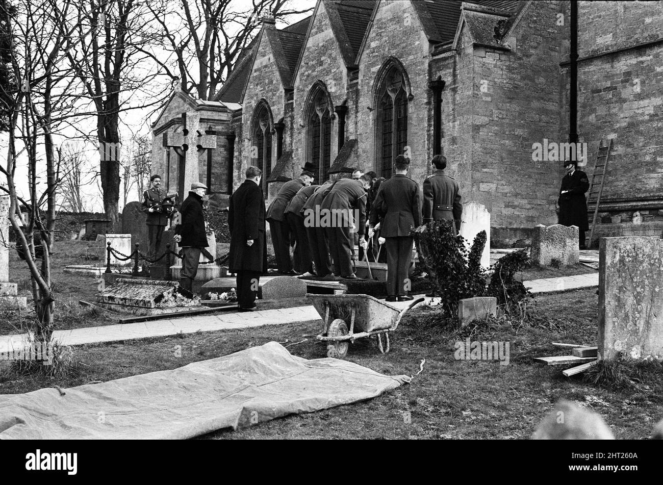 A full scale rehearsal of Sir Winston Churchill's funeral is carried out in Oxfordshire. Pallbearers from the Irish Guards lowering the coffin into the newly prepared grave in the Churchyard at St Martin's Church, Bladon. 28th January 1965. Stock Photo