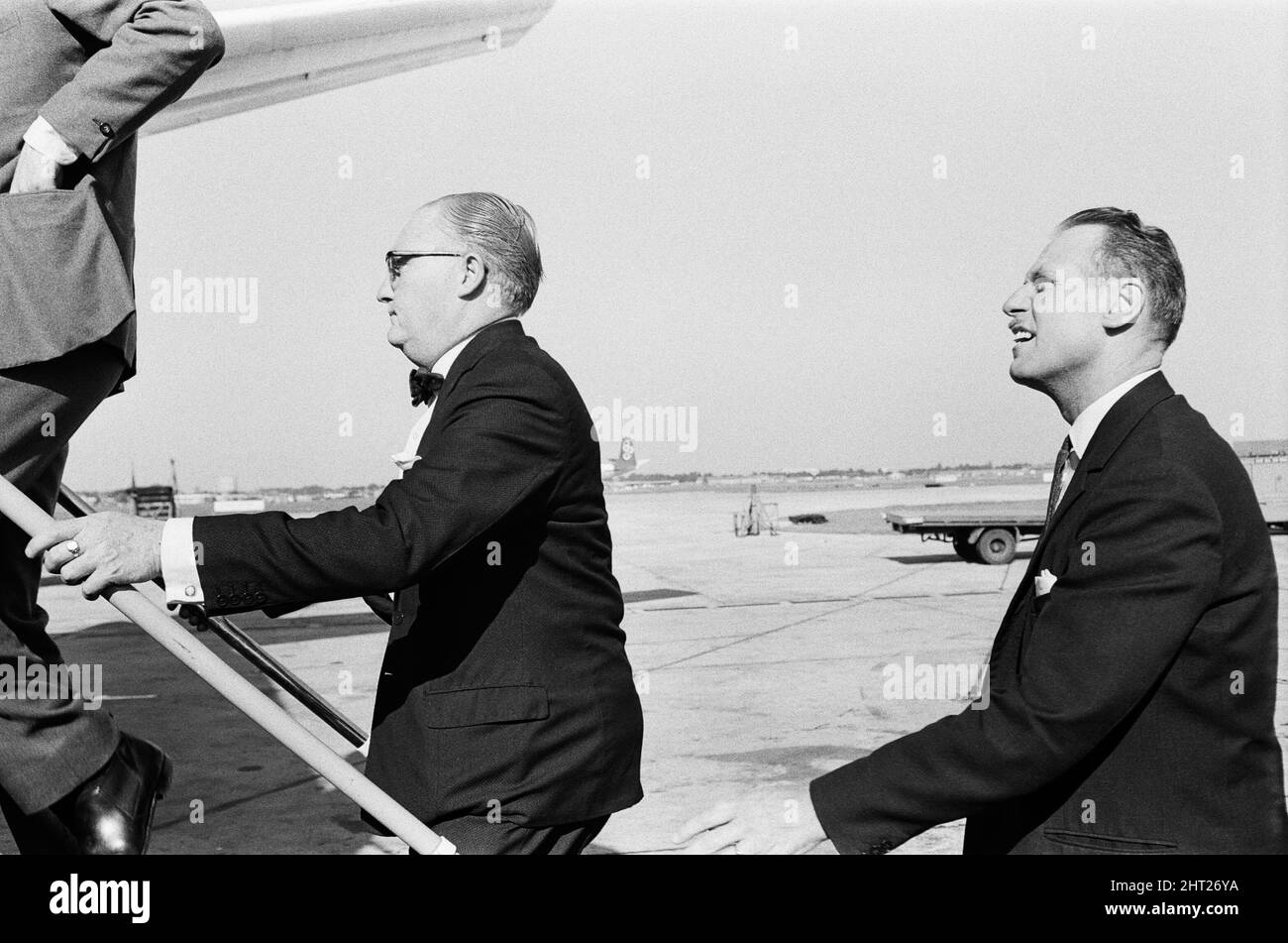 Detective Chief inspector John Hensley (wearing glasses) and Detective Inspector Jack Slipper leave London airport for Glasgow to bring John Duddy back to London. John Duddy was wanted for questioning in connection with the shooting of three London policemen. He later went on to be convicted of murder and possession of firearms and sentenced to life imprisonment. 18th August 1966. Stock Photo