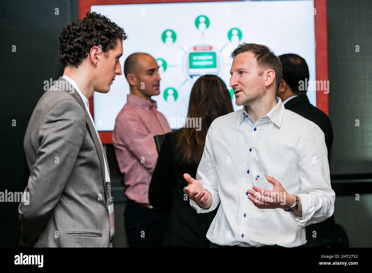 Vendors demonstrating a product service at retail industry confe Stock ...