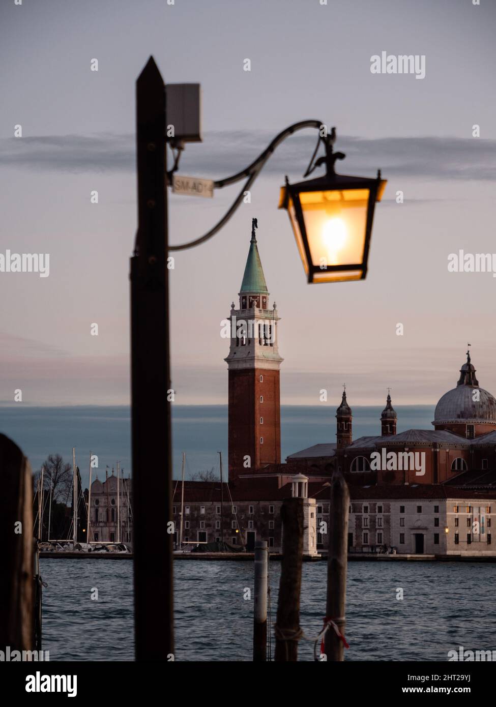 Campanile Bell Tower of San Giorgio Maggiore Church and Lantern at Dusk in the Evening Stock Photo