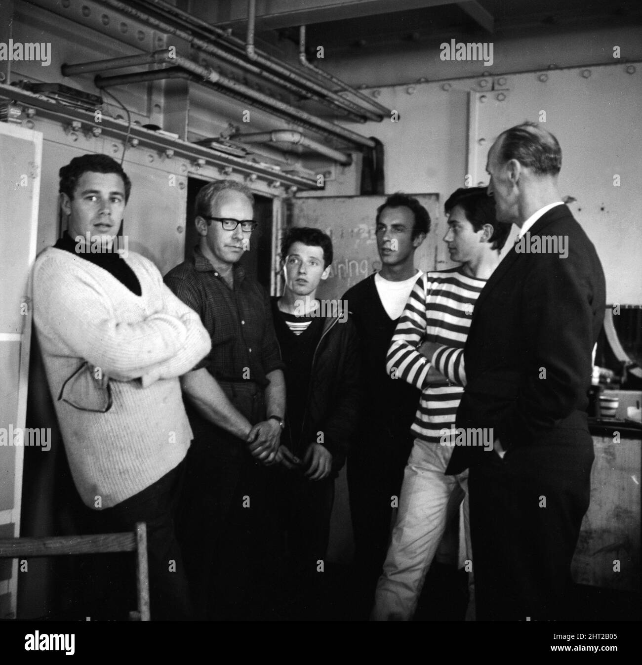 Radio City Pirate radio station in the North Sea situated on a old World War Two fort. L - R Ian Macrae, Paul Elvey, Leslie Dunne, Unknown,  Tatty Tom Edwards(Stripes)  and Detective Superintendant George Brown   31st August 1965 Stock Photo