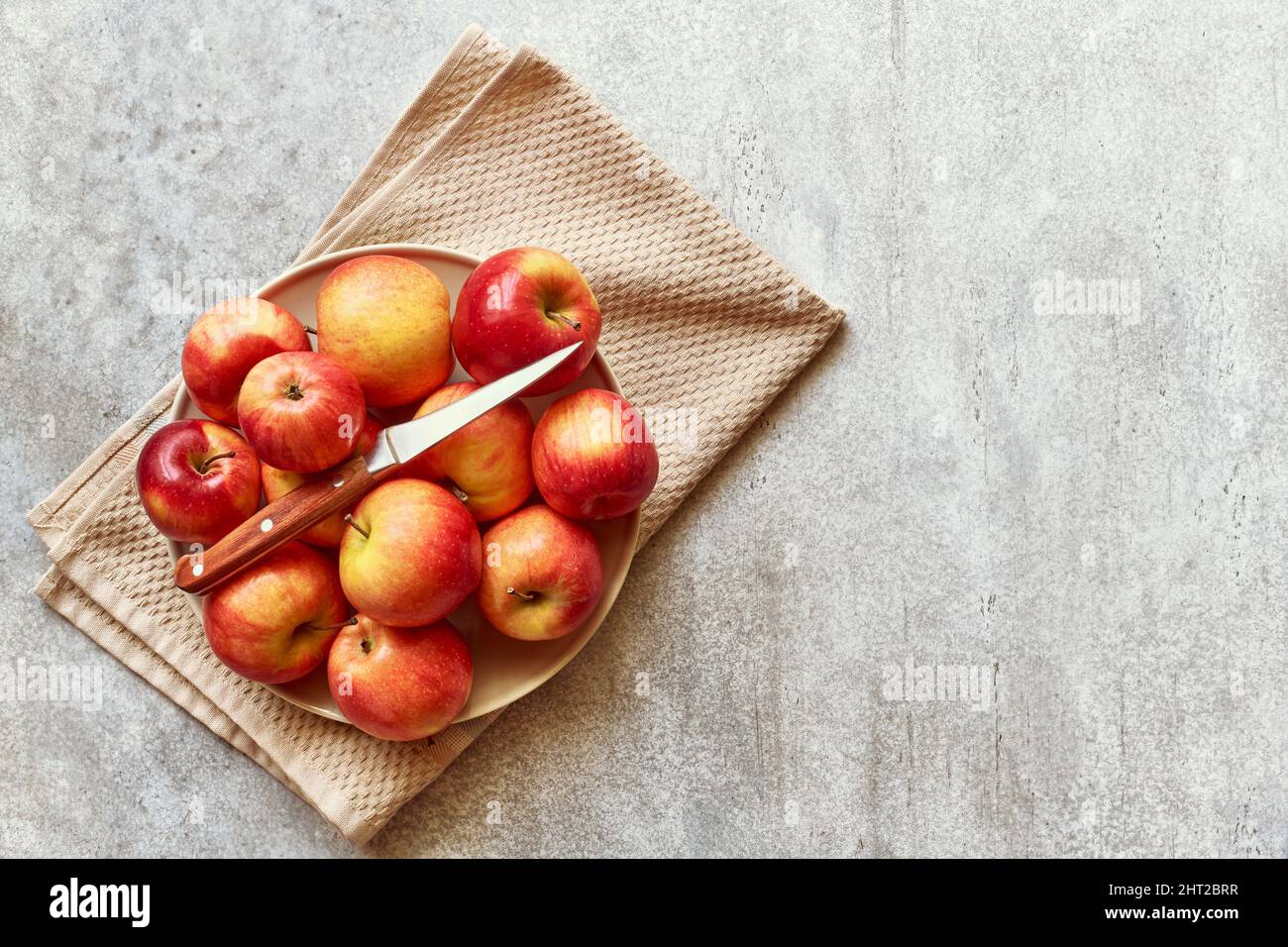 Ripe yellow and red apples on a plate, healthy eating, top view Stock ...
