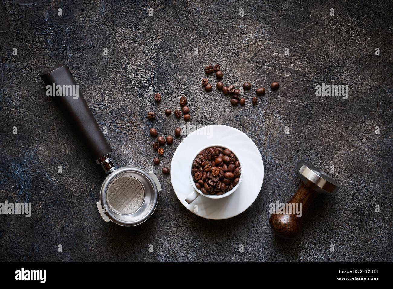https://c8.alamy.com/comp/2HT2BT3/barista-tools-and-coffee-cup-with-beans-on-dark-textured-stone-background-top-view-with-copy-space-2HT2BT3.jpg