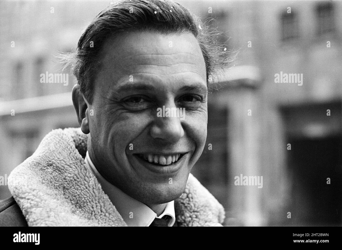 TV Presenter David Attenborough walking to work on a snowy morning the day after his appointment as controller of BBC2. 4th March 1965. Stock Photo