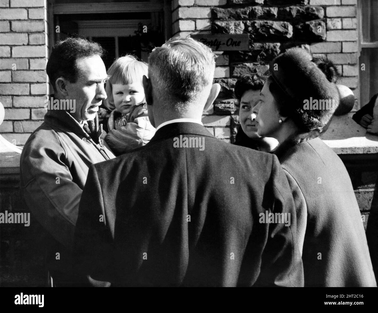 Her Majesty Queen Elizabeth II  listens to a father recalling the day that brought desolation to Aberfan following the tragic landslide. Picture taken 29th October 1966 Stock Photo