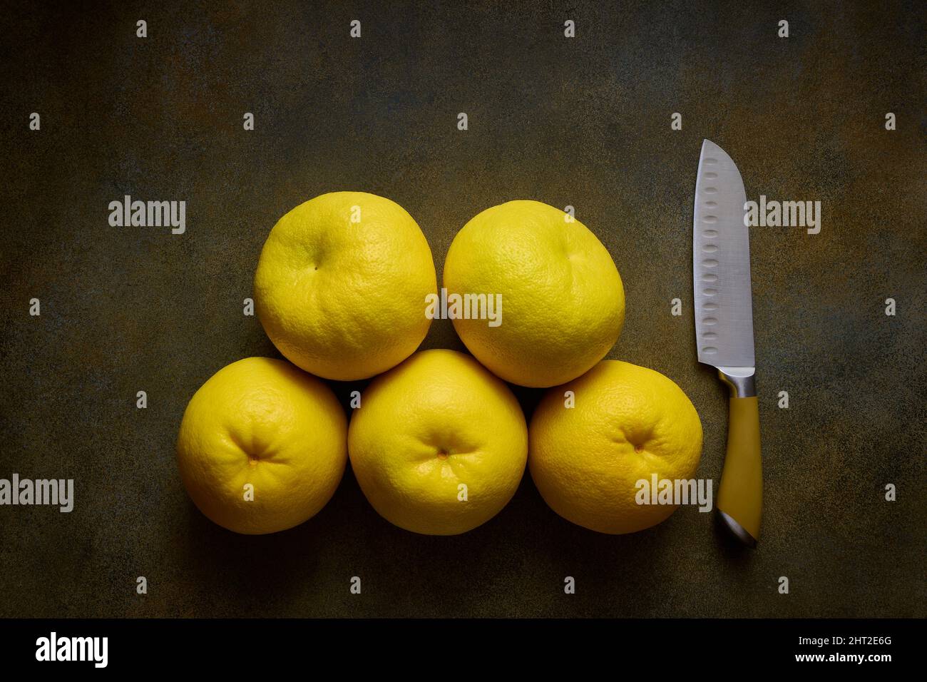 Brightly colored citrus knife on a background