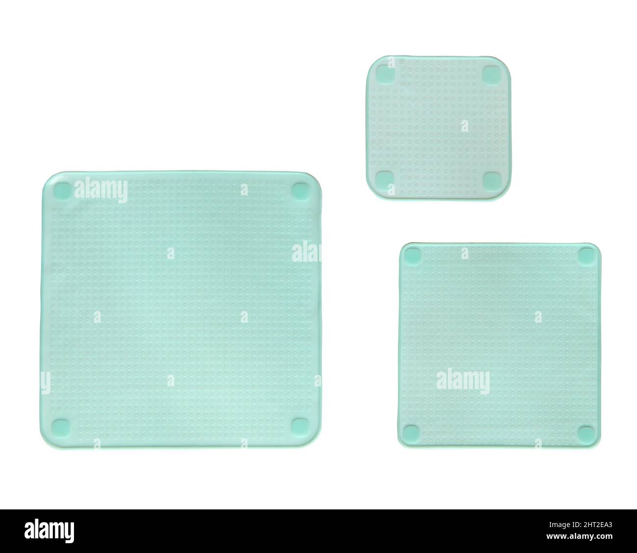 Three different sized silicone square stretch lids insulated on white background Stock Photo