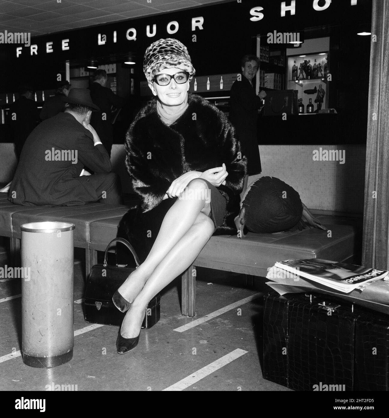 Sophia Loren at London Airport, leaving for Paris where she will do some shopping prior to her return to Italy. She has just finished filming in this country, for her latest picture 'Lady L'. 1st April 1965. Stock Photo