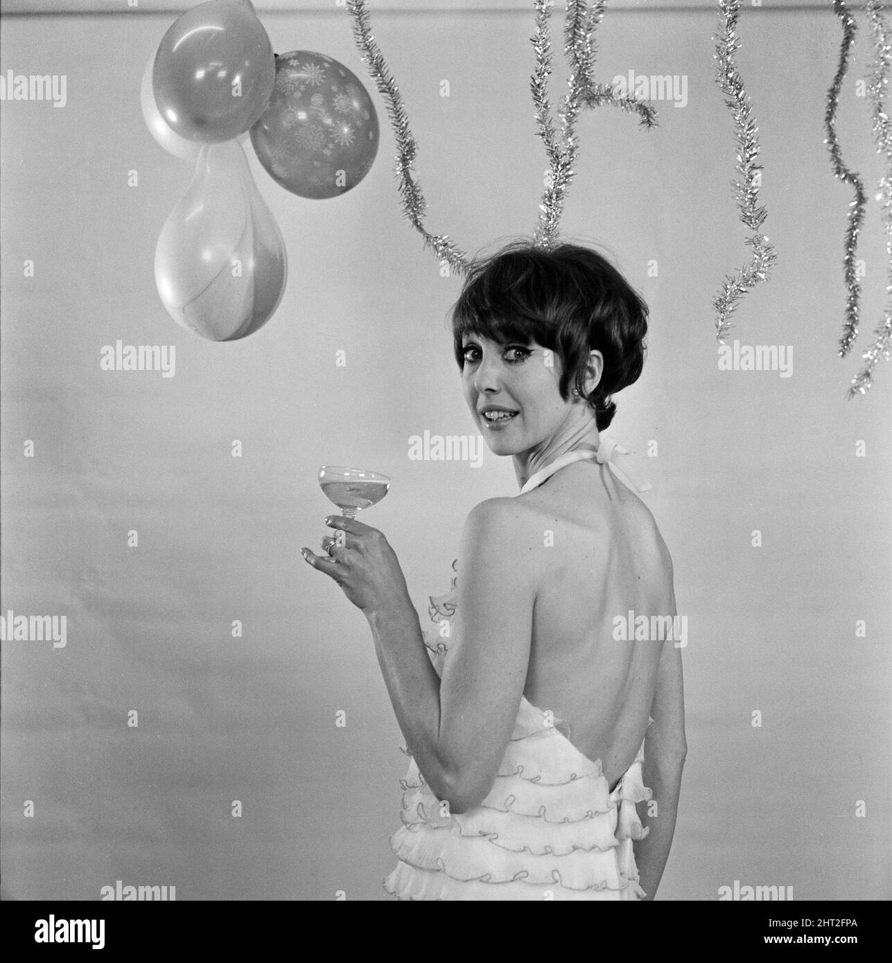 Una Stubbs wishes you a Happy New Year from the TV Centre, BBC Wood Lane, West London. 23rd December 1966. Stock Photo