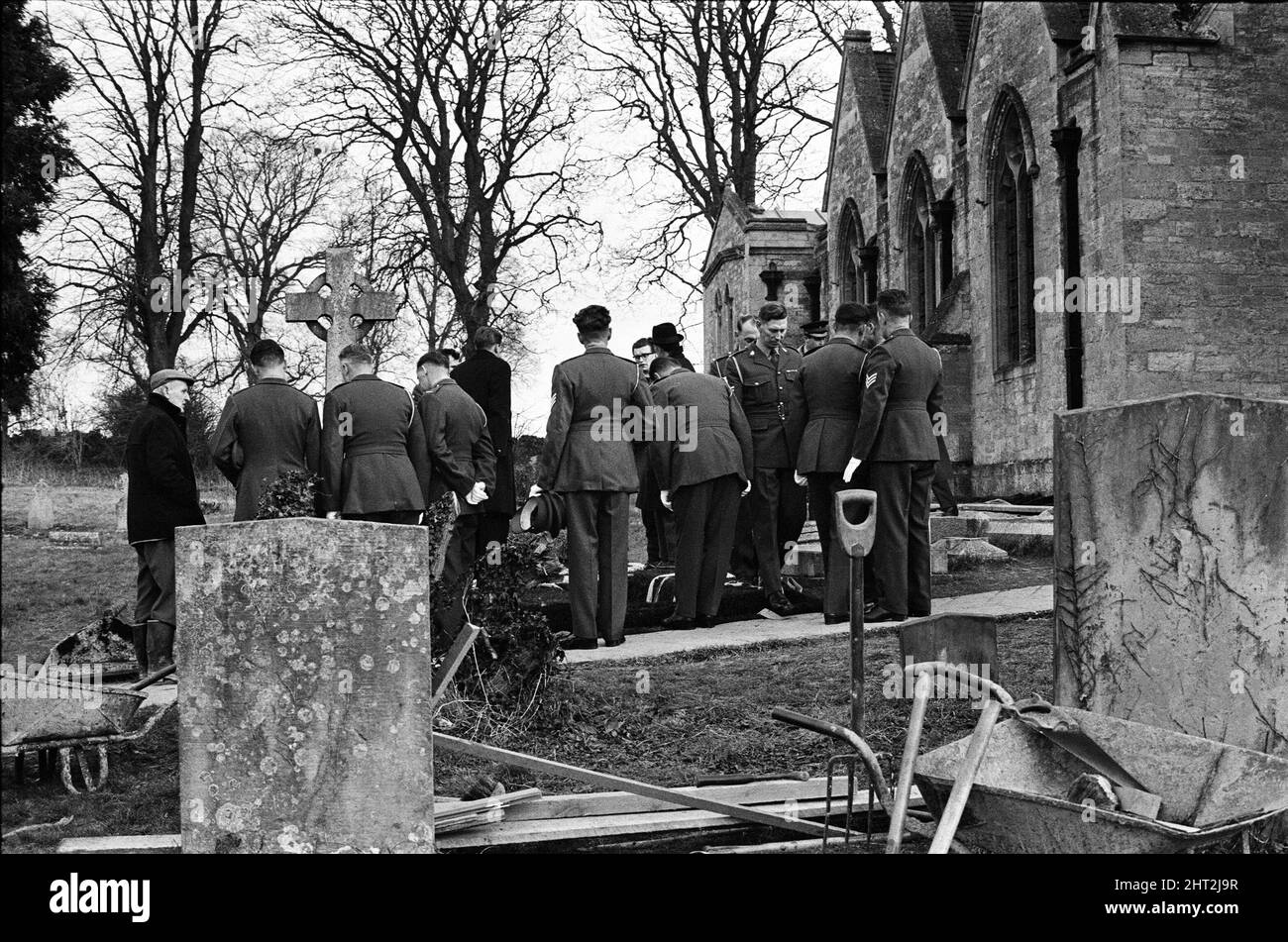 A full scale rehearsal of Sir Winston Churchill's funeral is carried out in Oxfordshire. Pallbearers lowering the coffin into the newly prepared grave in the Churchyard at St Martin's Church, Bladon. 28th January 1965. Stock Photo