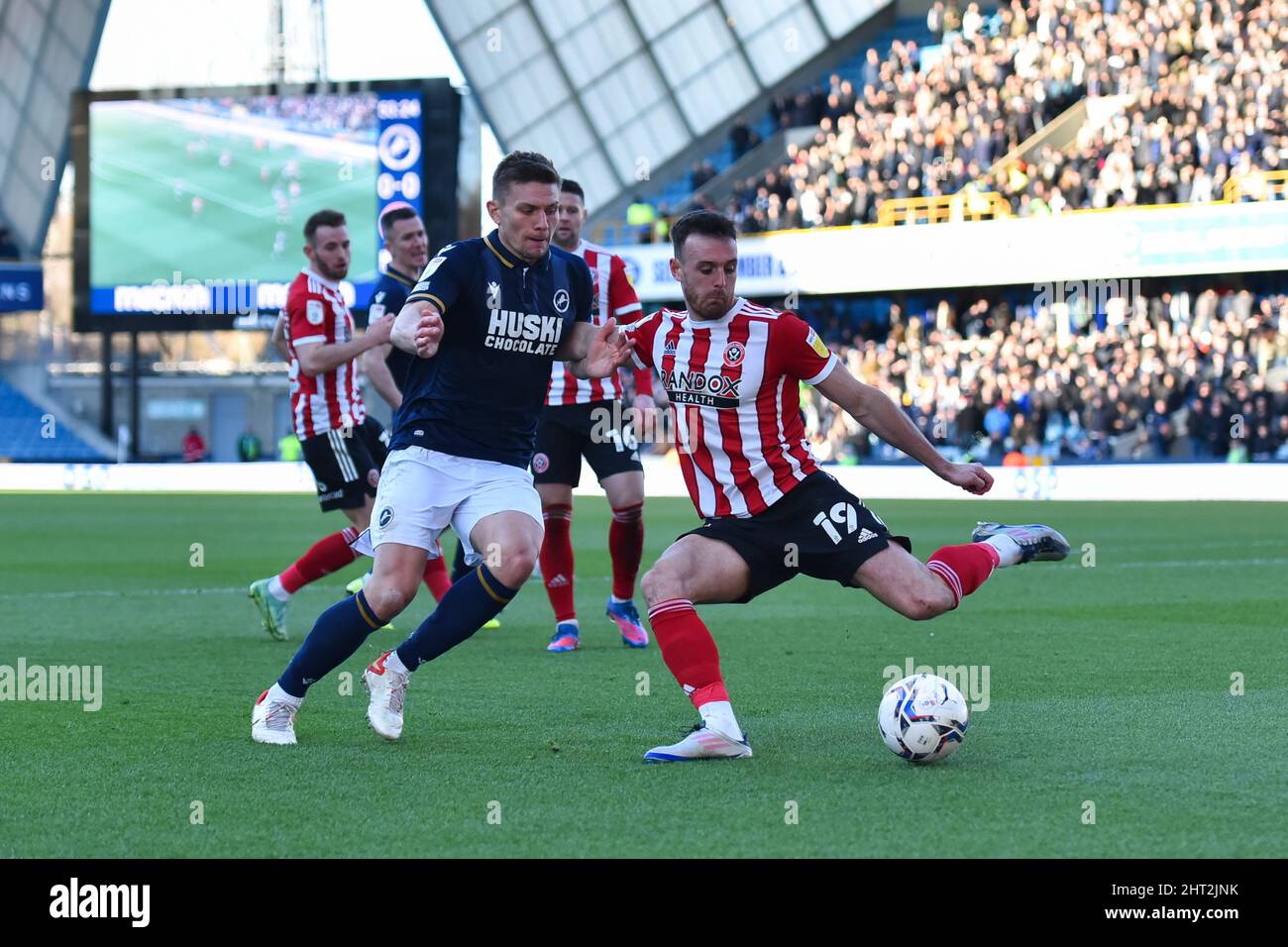 LONDON, UK. FEB 26TH Jack Robinson of Sheffield United battles for possession with Shaun Hutchinson of Millwall during the Sky Bet Championship match between Millwall and Sheffield United at The Den, London on Saturday 26th February 2022. (Credit: Ivan Yordanov | MI News) Credit: MI News & Sport /Alamy Live News Stock Photo