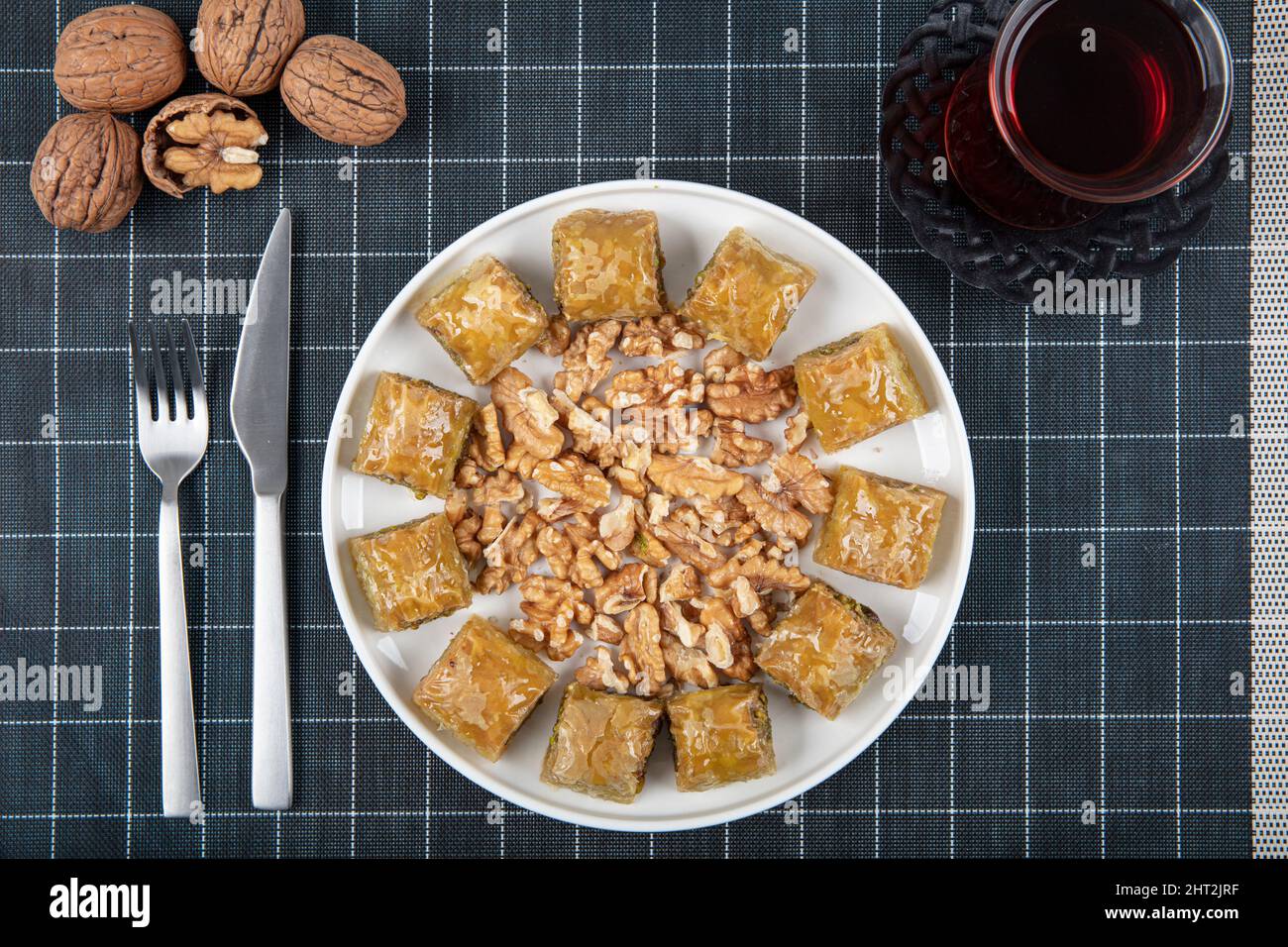 Traditional Turkish dessert walnut baklava with walnuts and tea on a