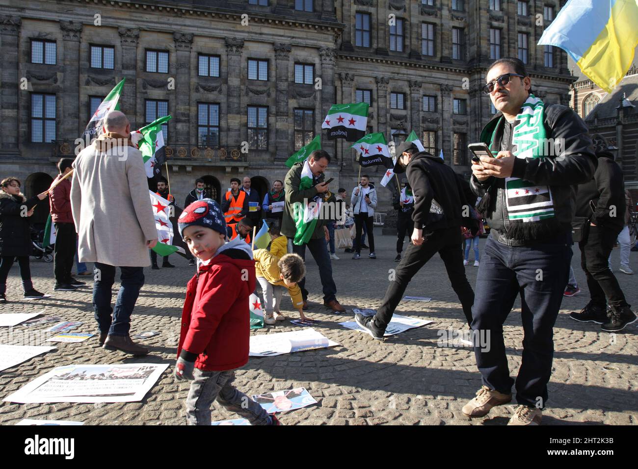 Amsterdam, Netherlands. 26th Feb, 2022. Members of the Syrian community take part during Syria Wants Freedom demonstration to protest against Assad regime forces and its supporters' attacks on civilians and the humanitarian plight and Russian military invasion of Ukraine at the Dam Square on February 26, 2022 in Amsterdam, Netherlands. (Photo by Paulo Amorim/Sipa USA) Credit: Sipa USA/Alamy Live News Stock Photo