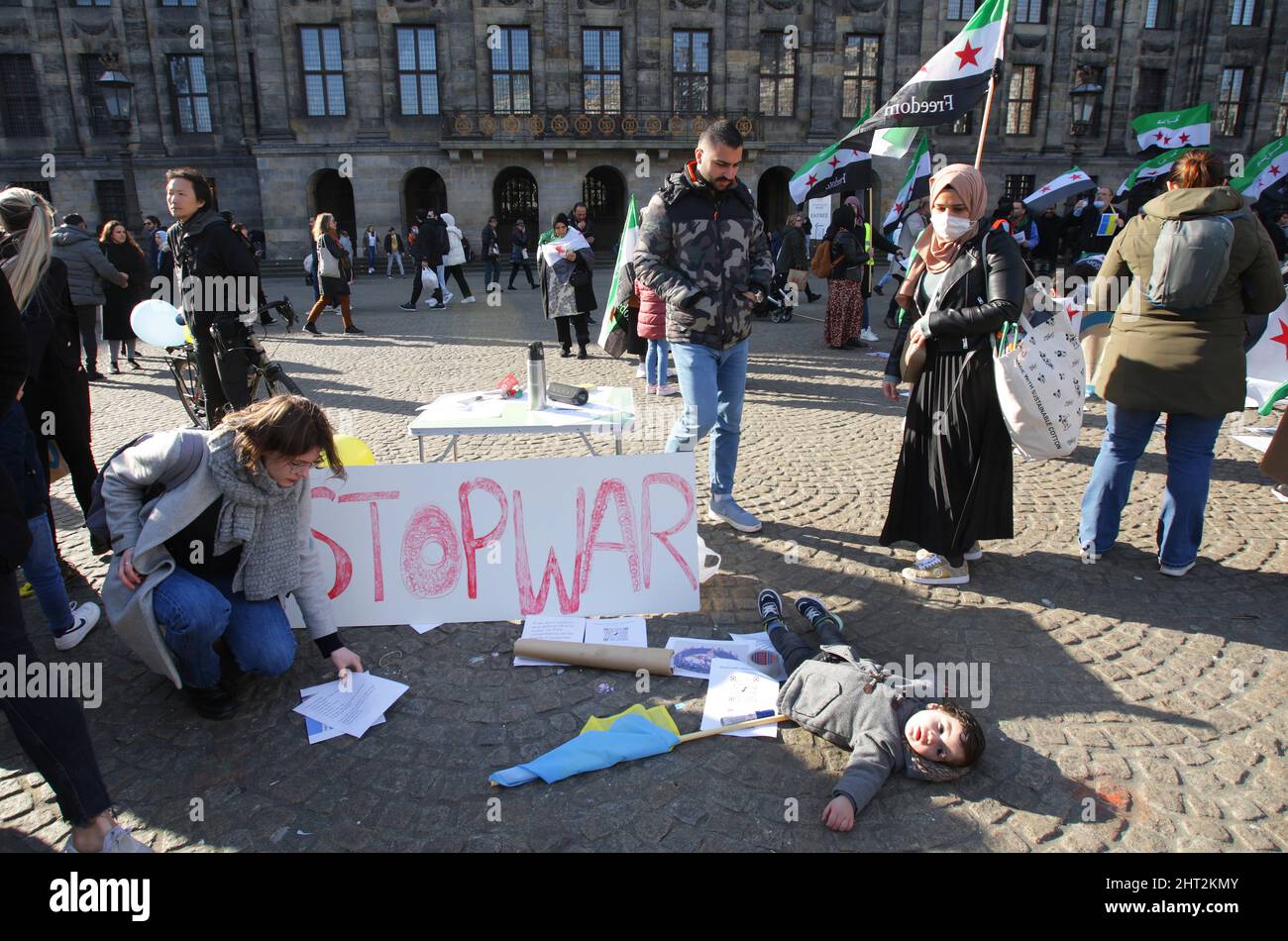 Amsterdam, Netherlands. 26th Feb, 2022. Members of the Syrian community take part during Syria Wants Freedom demonstration to protest against Assad regime forces and its supporters' attacks on civilians and the humanitarian plight and Russian military invasion of Ukraine at the Dam Square on February 26, 2022 in Amsterdam, Netherlands. (Photo by Paulo Amorim/Sipa USA) Credit: Sipa USA/Alamy Live News Stock Photo