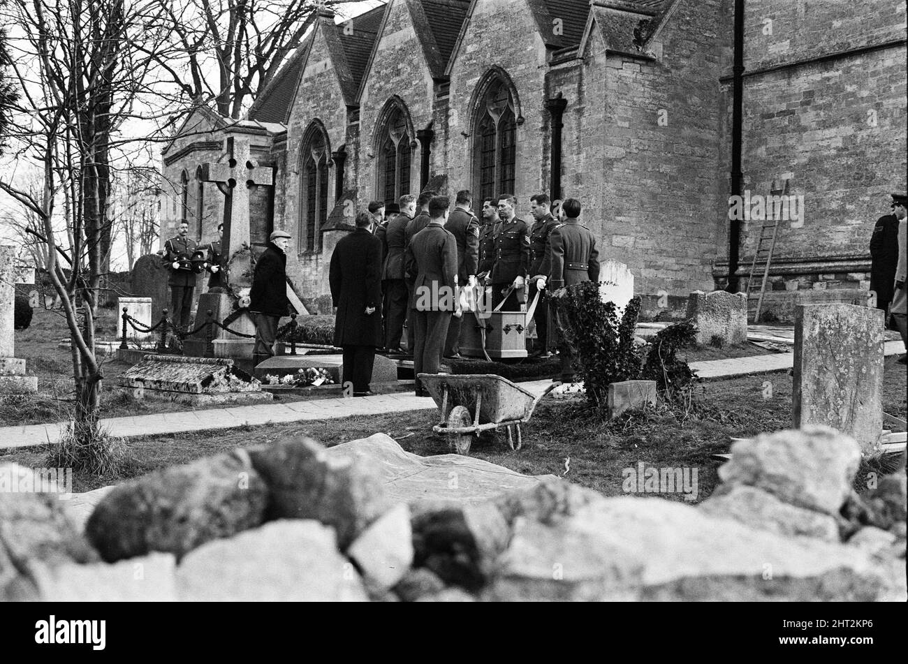 A full scale rehearsal of Sir Winston Churchill's funeral is carried out in Oxfordshire. Pallbearers from the Irish Guards lowering the coffin into the newly prepared grave in the Churchyard at St Martin's Church, Bladon. 28th January 1965. Stock Photo