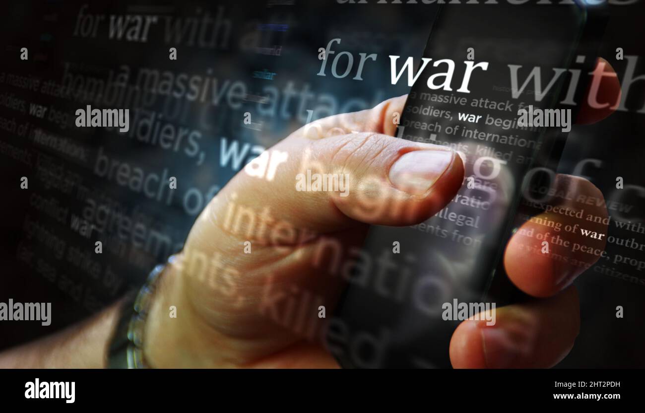 Social media on display with war outbreak and military attack. Searching on tablet, pad, phone or smartphone screen in hand. Abstract concept of news Stock Photo