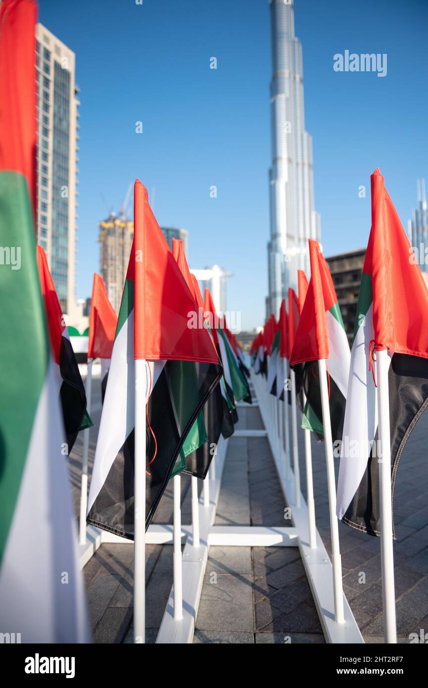 Vertical shot of many flagpoles with the flags of Dubai Stock Photo Alamy