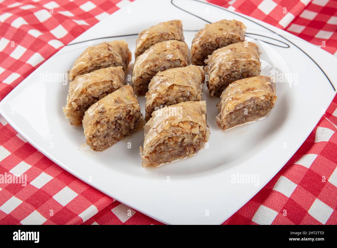 Traditional Turkish dessert walnut baklava with walnuts and tea on a