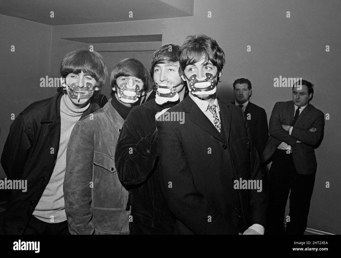 The Beatles with smog masks on before playing at the Ardwick Theare, Manchester.7th December 1965. Stock Photo