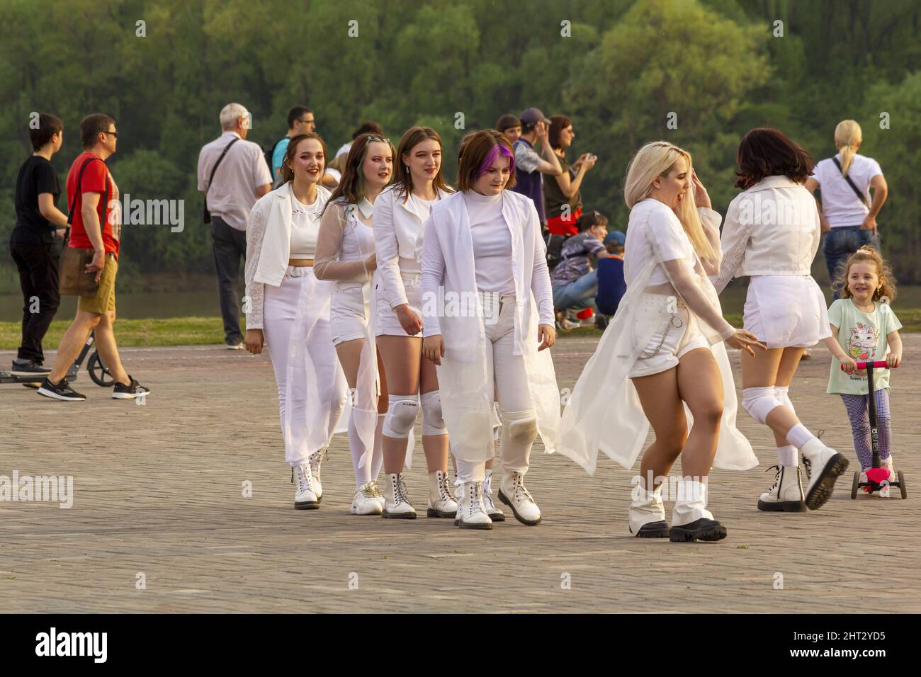 Omsk, Russia. 9 May, 2021. Preparation for flash mob on mass dance. A group of girls in white clothes rehearsed their dance. Stock Photo