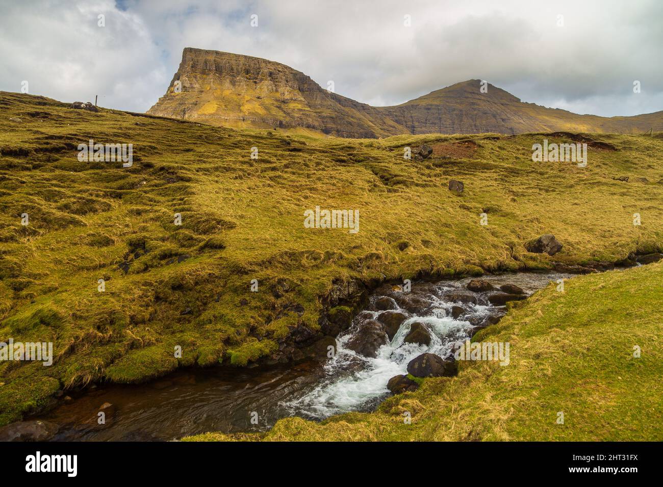 Mountain landscape on the island of Vagar. Cloudy spring day. Faroe ...