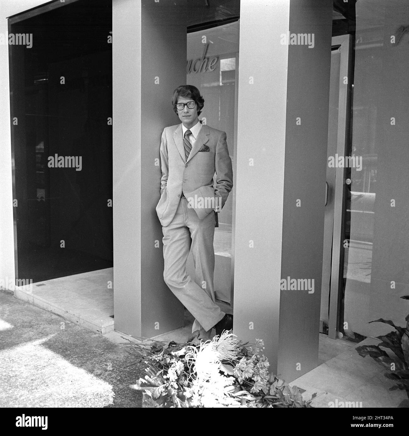 Yves St. Laurent pictured outside his new boutique in the Rue de