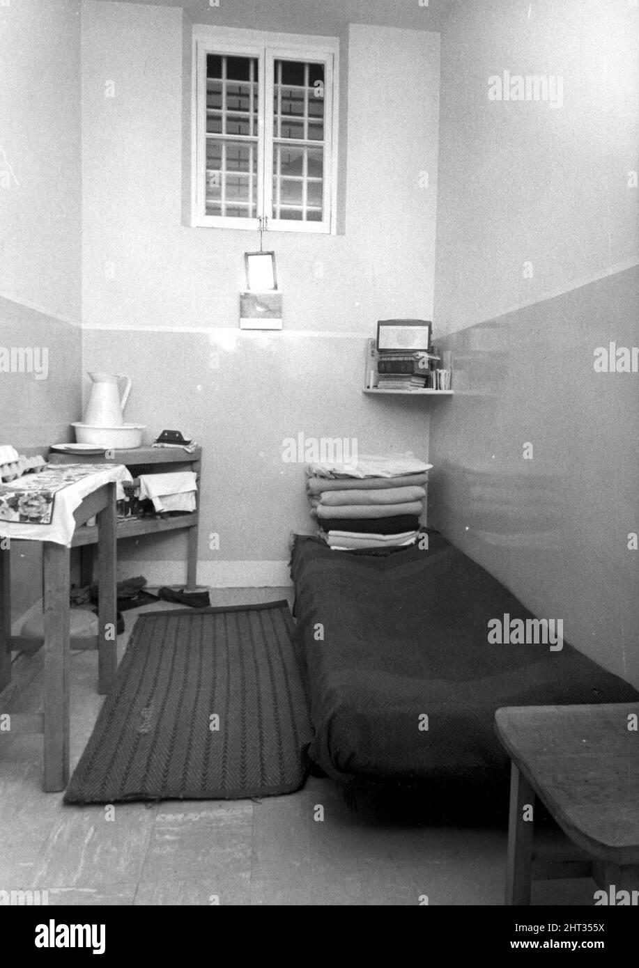 An interior view showing a prisoners bed inside one of the cells at
