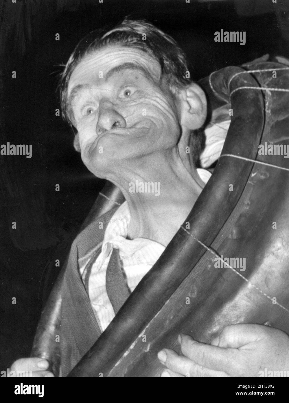 Mr Bennison demonstrates the winning twist - gurning. 18th September 1965 Stock Photo
