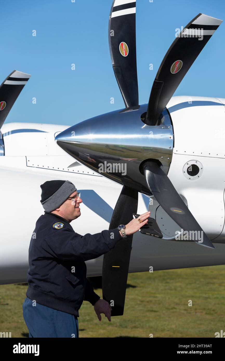 Chief test pilot Steven Crane prepares for a taxi test of the Alice V2 prototype all-electric aircraft at Eviation headquarters in Arlington Municipal Stock Photo