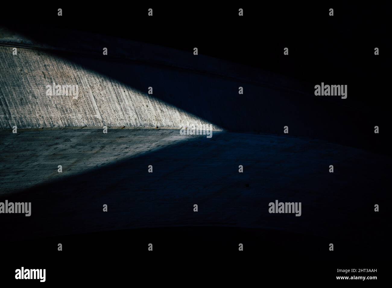 Shadow cast on the ground under a bridge Stock Photo - Alamy
