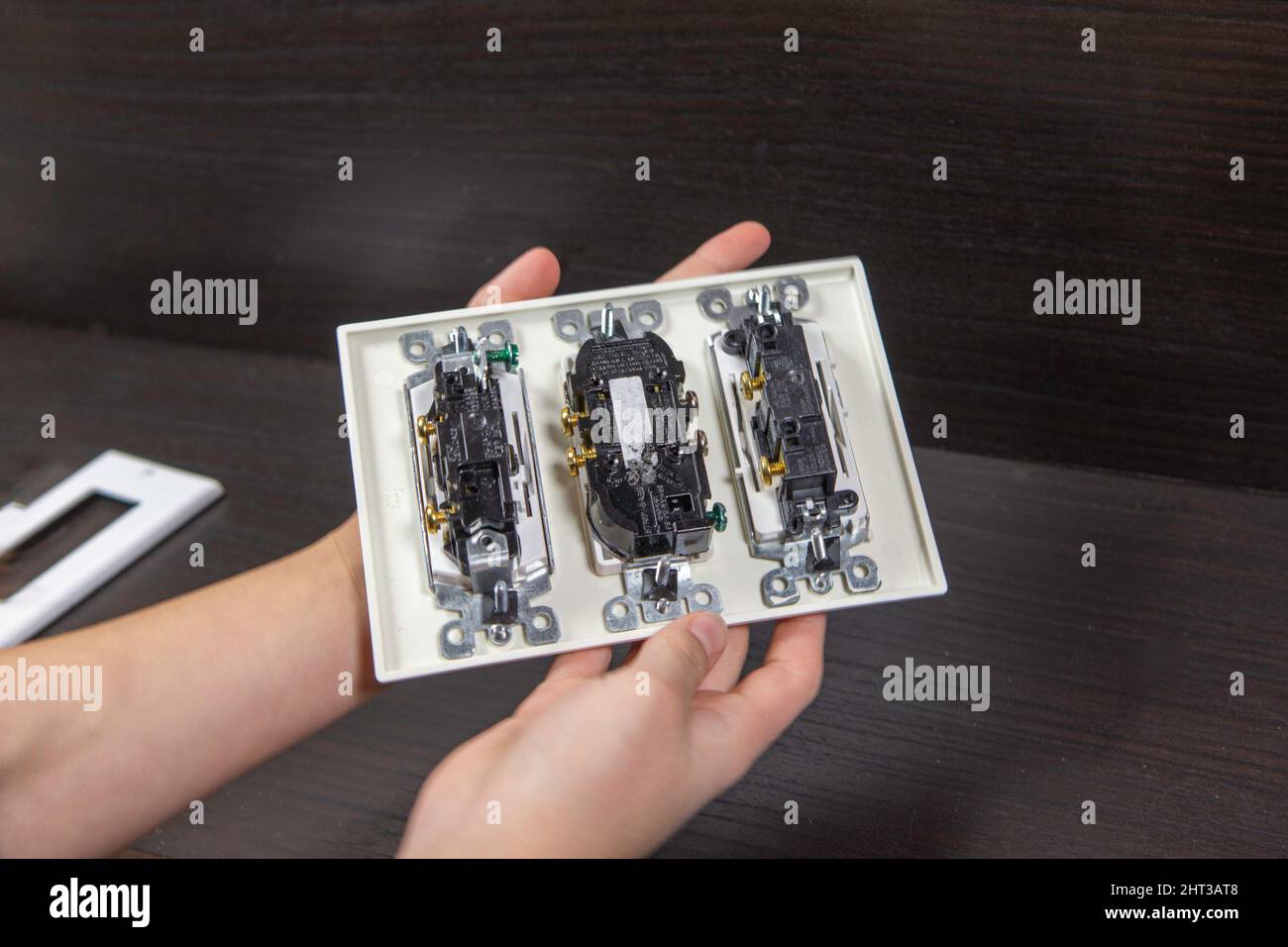Checking the electrical outlet before installing it in a junction box