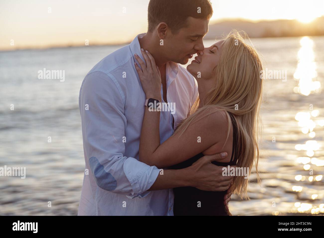 Pretty woman kissing man hi-res stock photography and images - Alamy