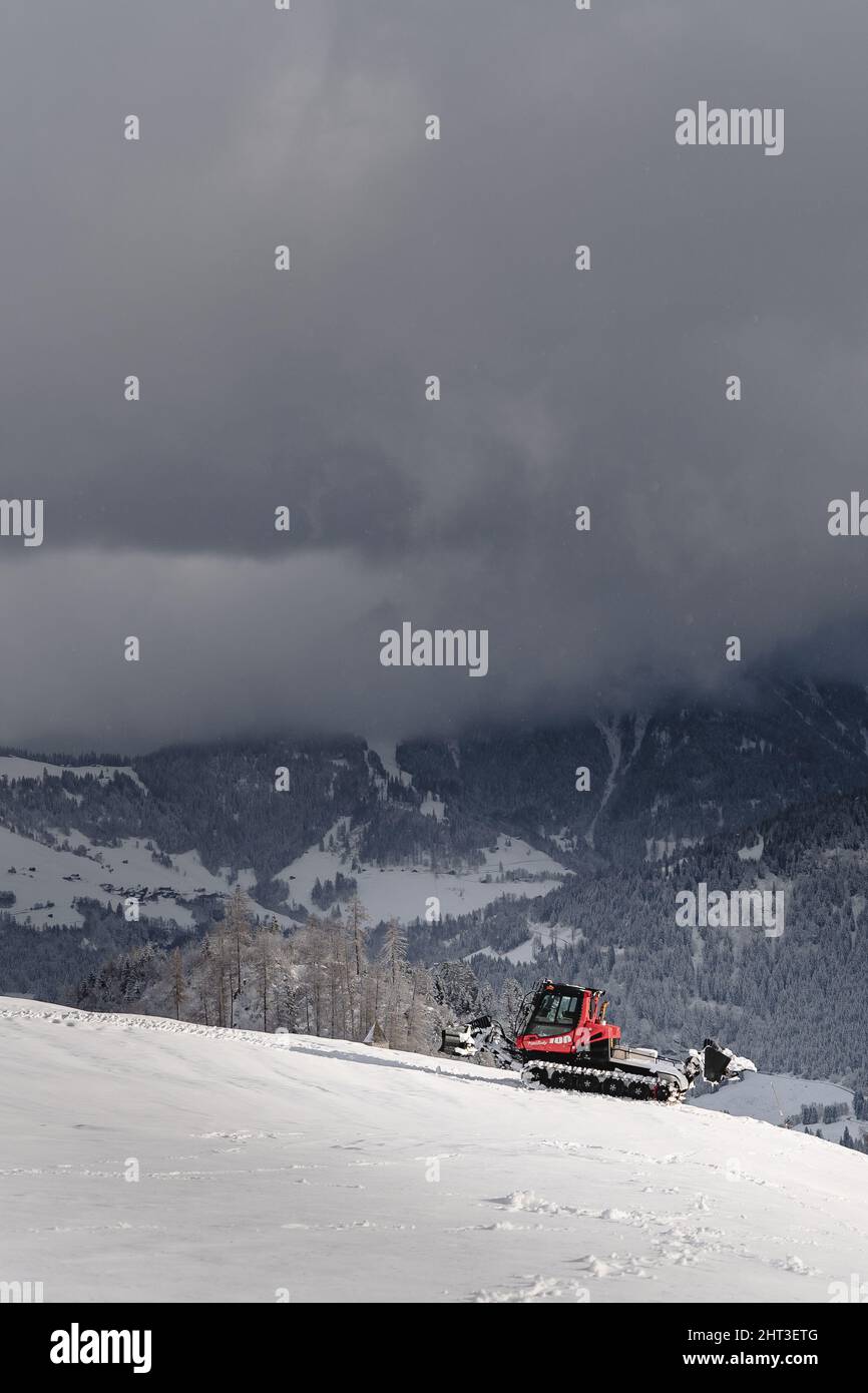 Pistenbully in Switzerland mountains in winter Stock Photo