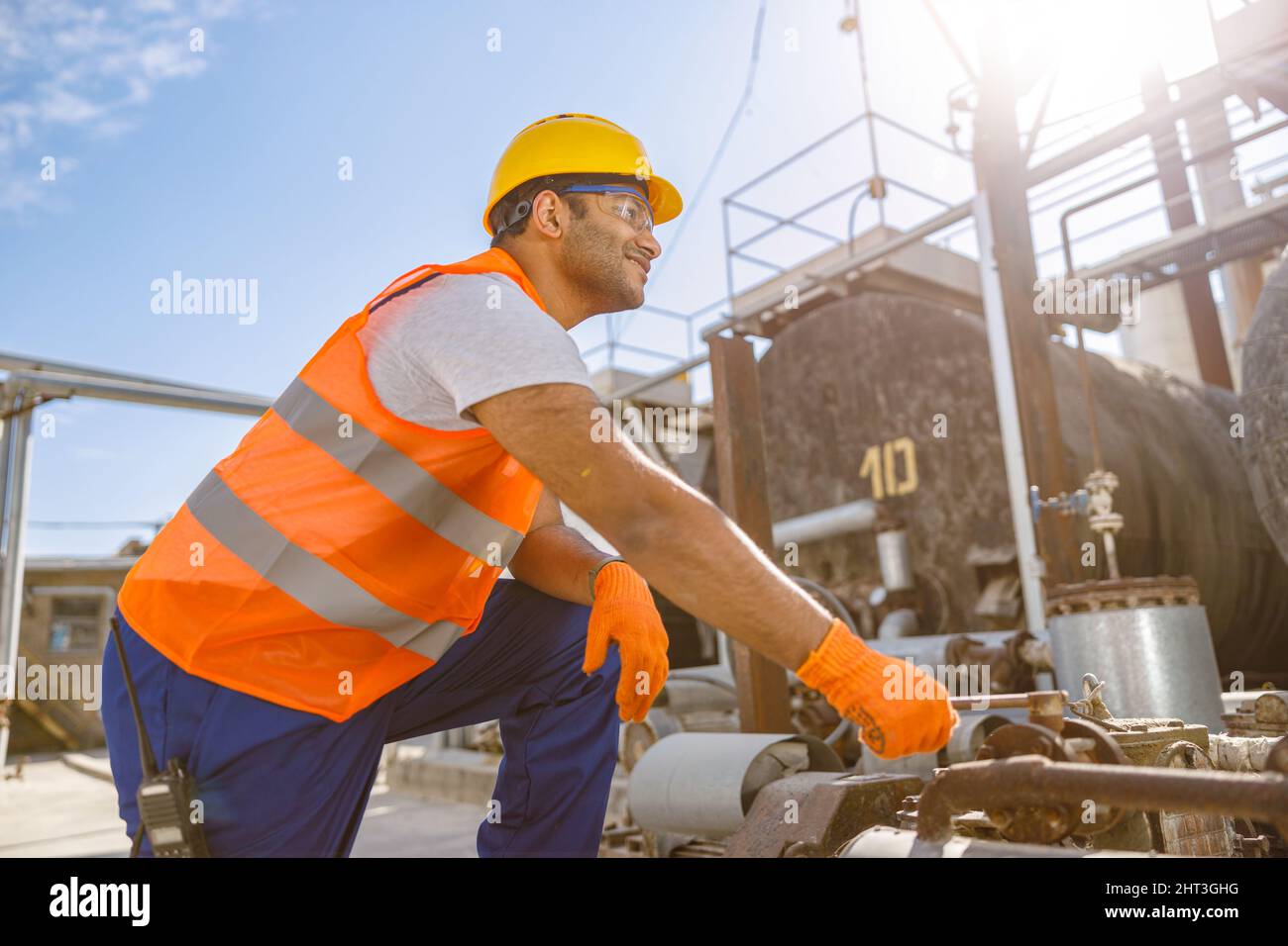 Photo of happy multiethnic worker in plant Stock Photo