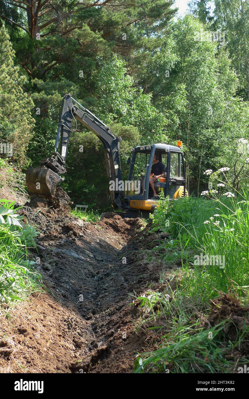 Drainage work with mini excavators Stock Photo Alamy