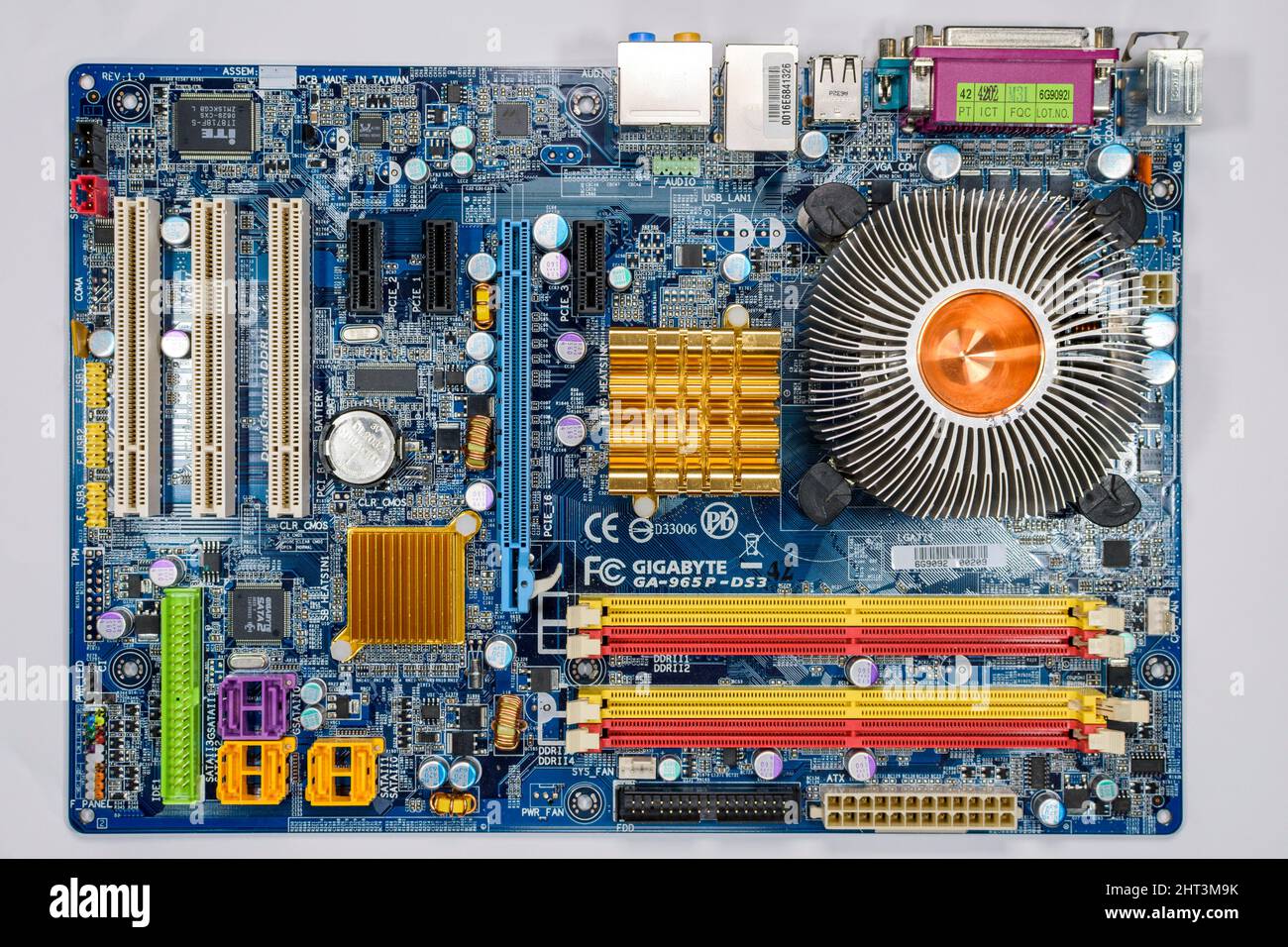 A desktop computer motherboard (Gigabyte 965PDS3) with the CPU cooling